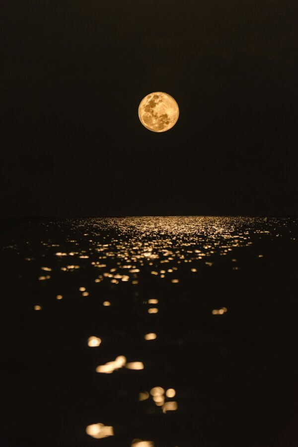 Golden Moon Reflection Over Water